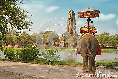 Tourists on an elephant ride tour