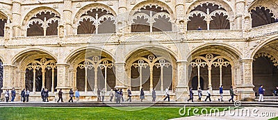 Tourists in the inner courtyard of the Jeronimos Monastery Cloister in Lisbon