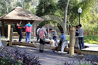 Tourists play plank bridge games