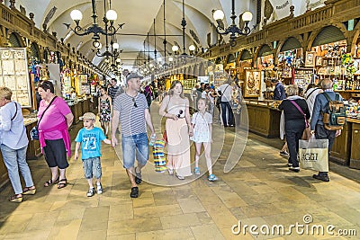 Tourists shop in Sukiennice Cloth