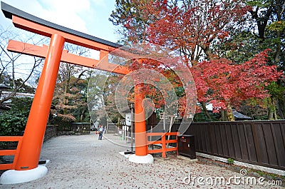 Tourists visit Shimogamo shrine orange archway in Kyoto, Japan