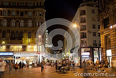 Tourists walk at night in center of Vienna