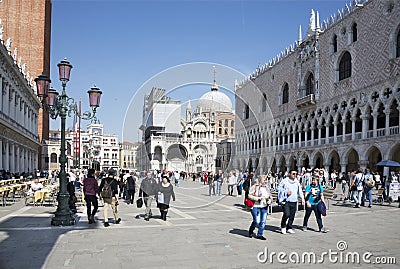 Tourists walk on the Piazza San Marco