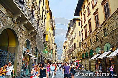 Tourists walking in crowded street in Florence