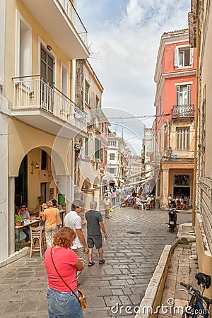 Tourists walking at the narrow streets in city center