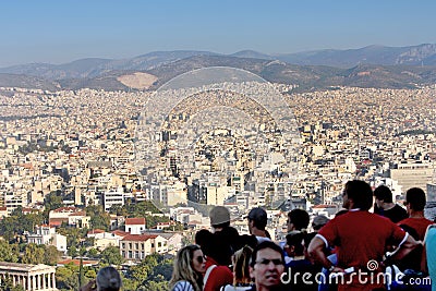 Tourists watching city panorama of Athens