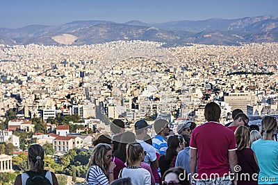 Tourists watching panorama of Athens in Greece