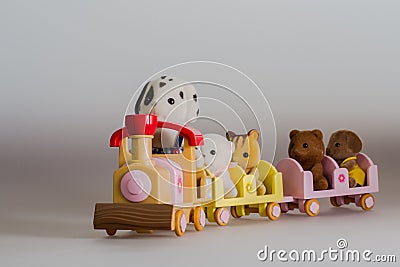 Toy animals sitting on toy train