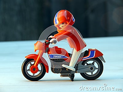 Toy biker on red bike