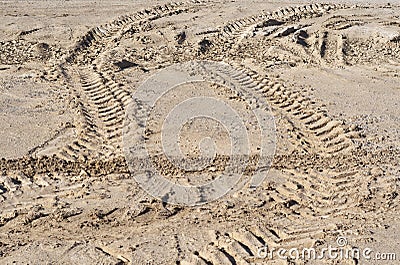 Traces of the wheel off-road truck tire on the dried soil