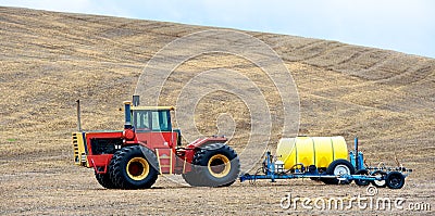 Tractor and agricultural sprayer