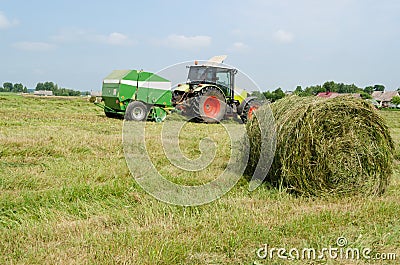 Tractor bailer collect hay in agriculture field