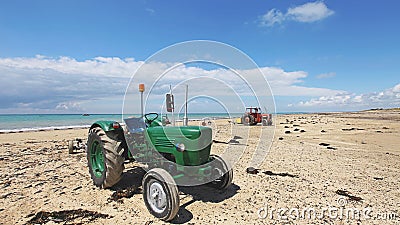 Tractor with boat trailer on the beach