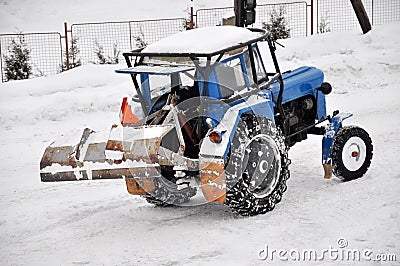 Tractor cleaning the road