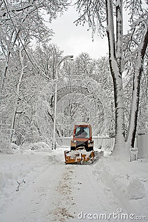 Tractor cleaning winter road