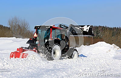 Tractor Plowing Snow on a Yard