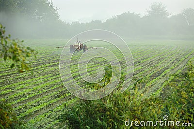 Tractor Spraying Crop