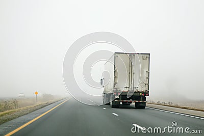Tractor Trailer Driving into Fog