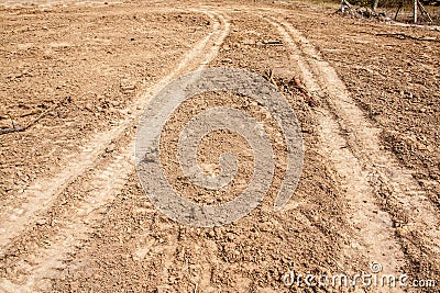 Tractor tyre tracks on the ground