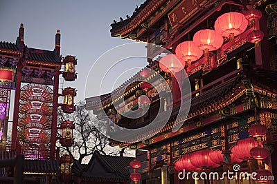 Traditional Chinese buildings illuminated at dusk in Beijing, China