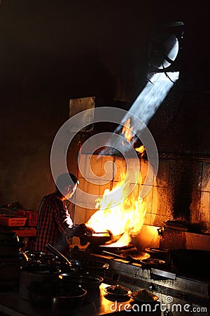 Traditional Chinese chefs working with chinese cooking methods in Kunming restaurant