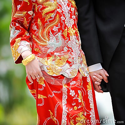 Traditional chinese wedding dress and western tuxedo