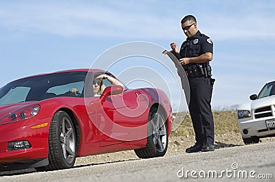 Traffic Cop Standing By Sports Car