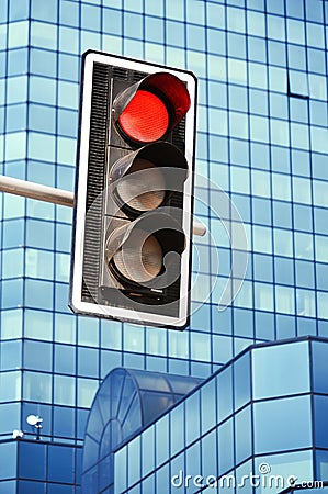 Traffic lights over modern business architecture
