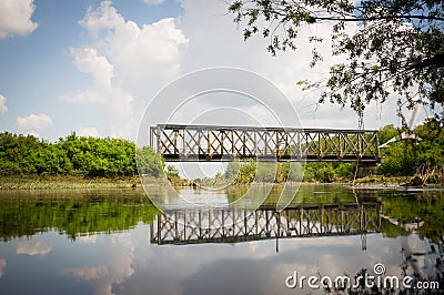 Train bridge reflected in the river