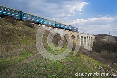 The train on bridge viaduct in spring