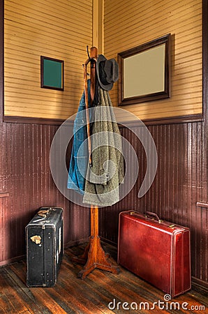 Train Station Coat Rack & Luggage in Corner