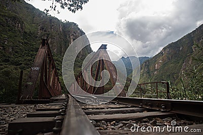 Train tracks towards Machu Picchu Inca ruins in Peru