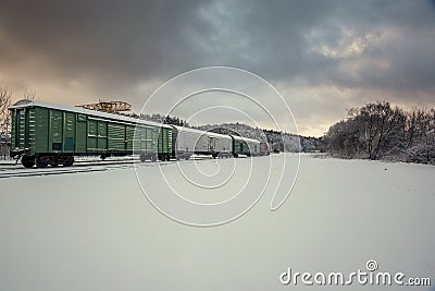 Train wagons in snowy winter landscape