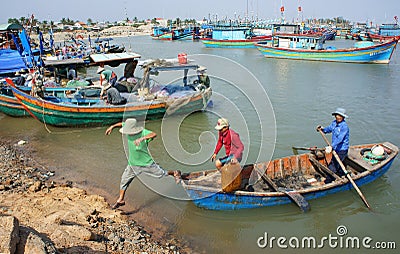 Transportation people and goods by wooden boat at habor