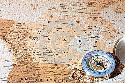 Travel destination Canada, ancient map with vintage compass