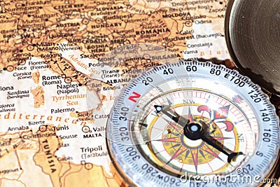 Travel destination Italy, ancient map with vintage compass