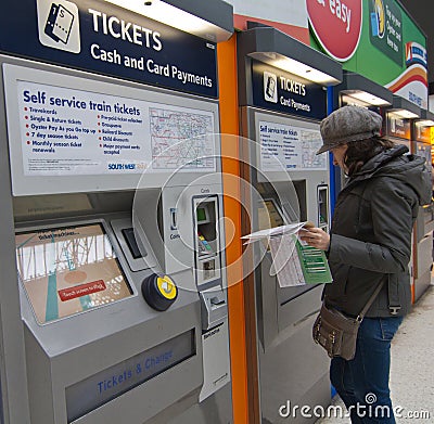 Traveler buying train tickets