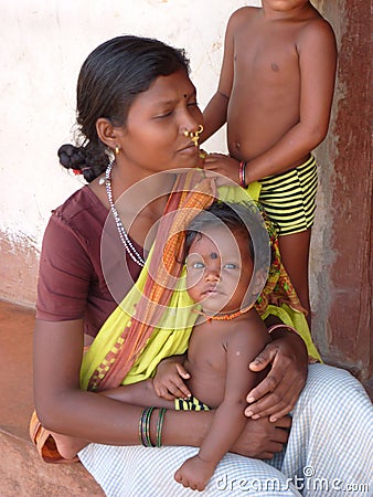 Tribal woman poses with her children
