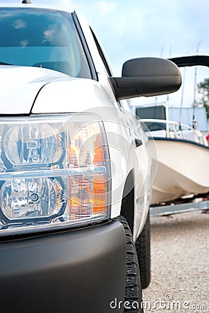 Truck closeup with fishing boat in background