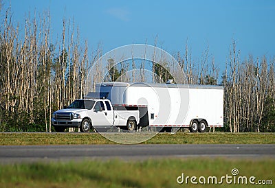 Truck towing trailer