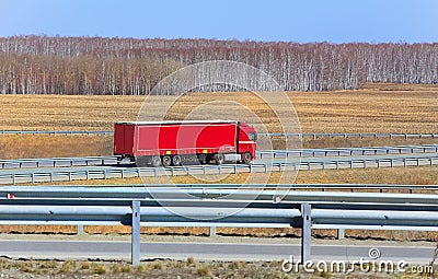 Truck with trailer goes on the highway