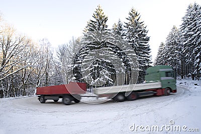 Truck with trailer on winter road