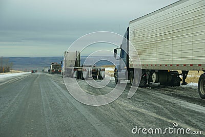 Trucks stop to remove chains