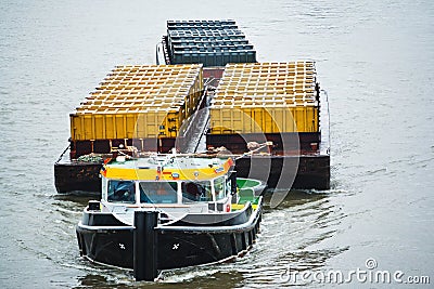 Tug boat transporting containers