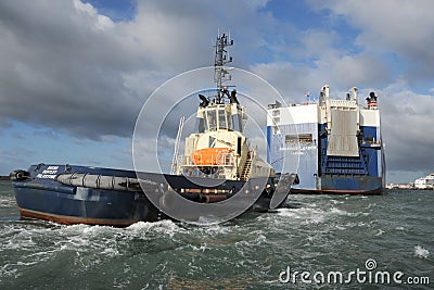Tug and cargo vessel