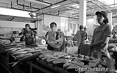 Tuna fish sellers at the market (Malaysia, Asia)