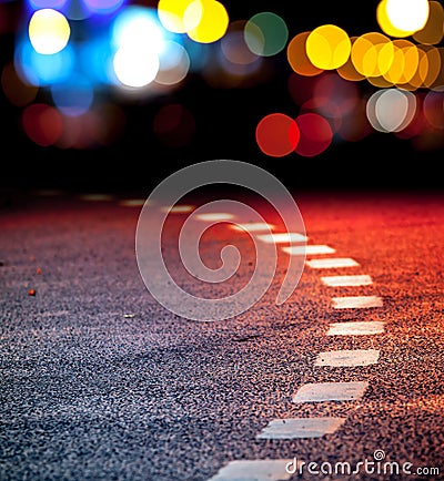 Turning asphalt road with marking lines and lights