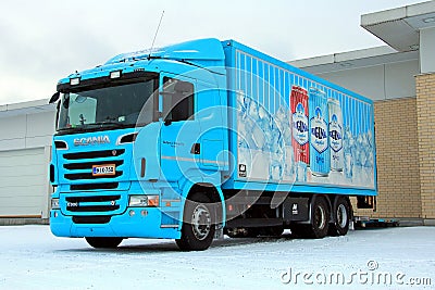 Turquoise Scania R500 Delivering Goods to a Store