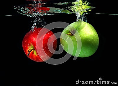 Two apples falling into water