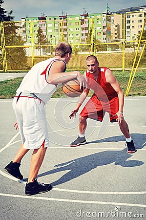 Two basketball players on the court